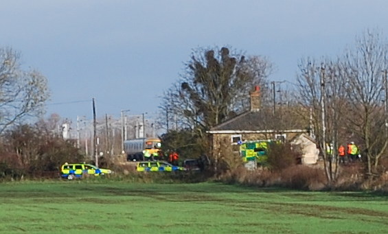 Emergenct vehicles at Fen Road crossing