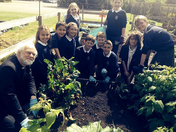 Rowan Williams with children from Milton Primary